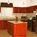 Kitchen with teak cabinets, granite countertops and stainless steel appliances